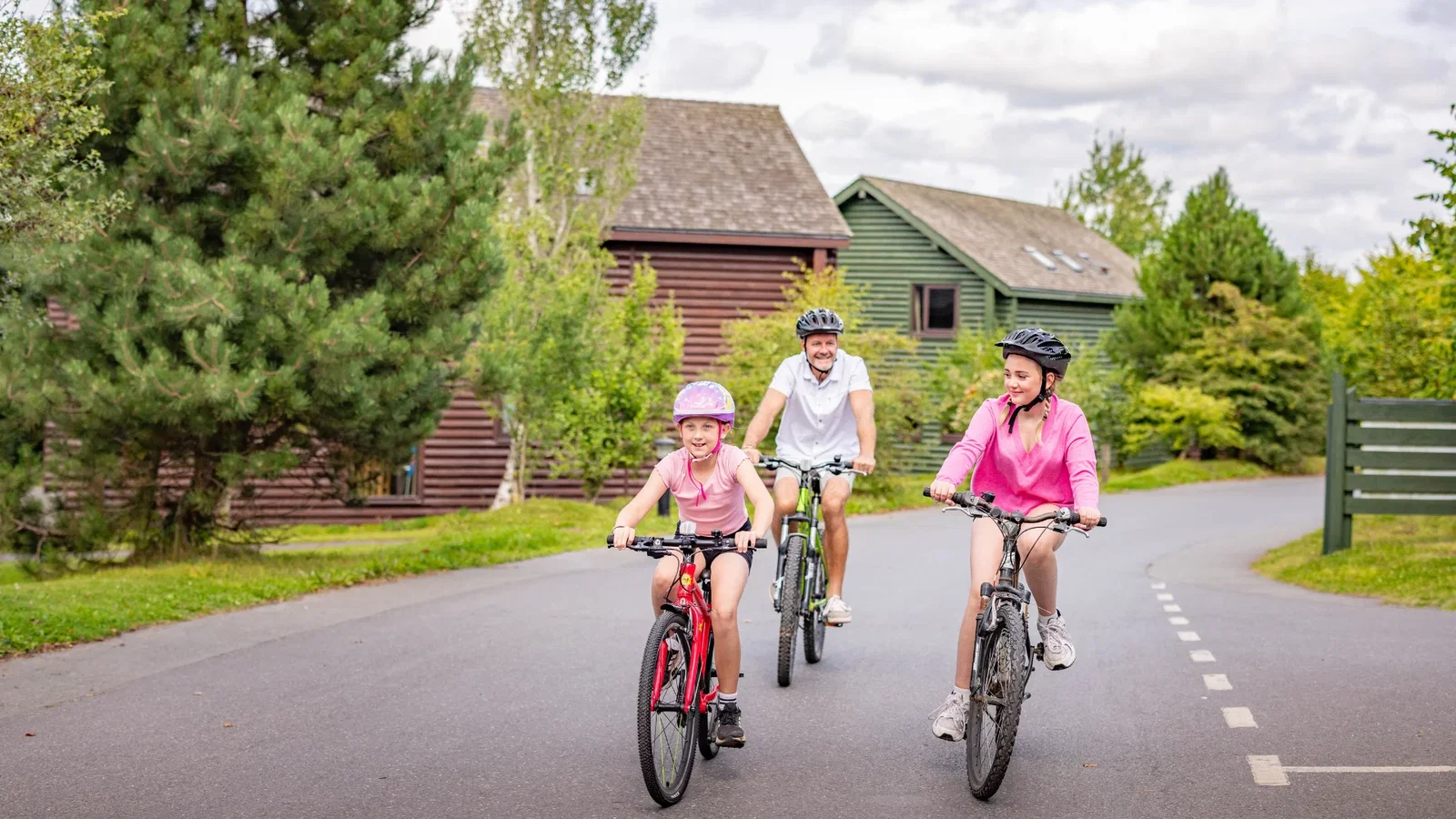 family exploring the resort on bikes on a sunny day