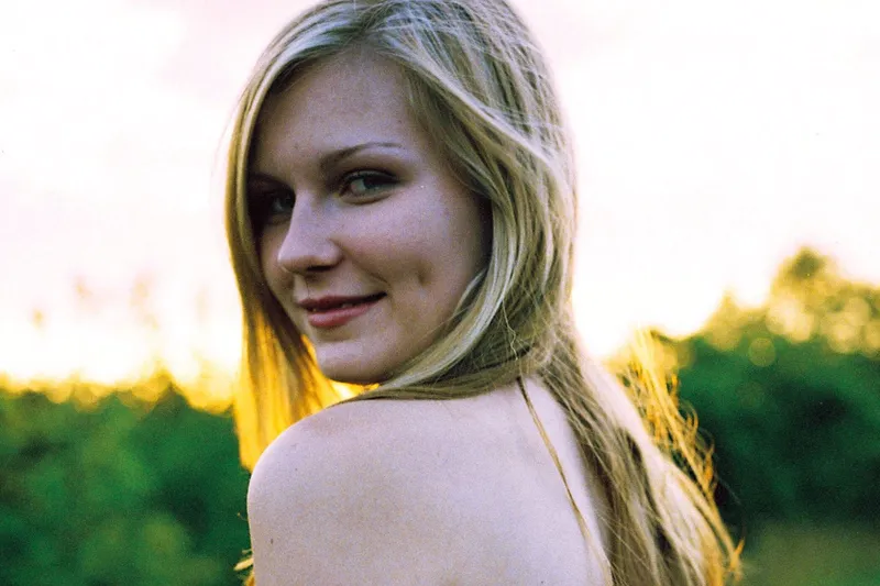 Image may contain: Kirsten Dunst, Blonde, Hair, Person, Clothing, Swimwear, Adult, Face, Head, Photography, and Portrait