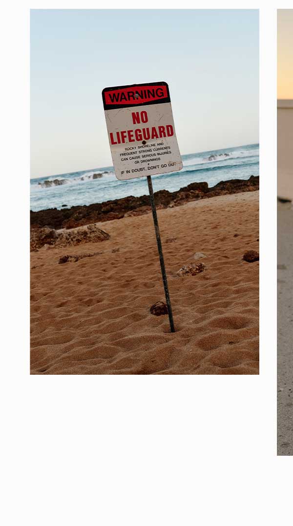 No Lifeguard sign on beach