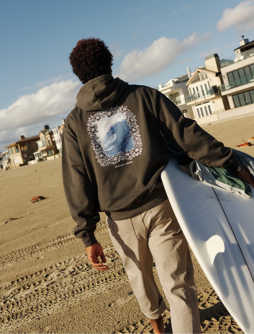 Model wearing the Visage Hoodie at the beach
