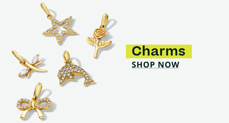 Multiple gold charms encrusted with diamonds. Charms. Click here to shop now