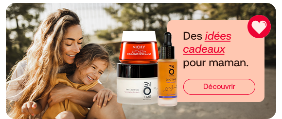 Bannière d’idées cadeaux pour maman: une femme enlace tendrement un enfant en plein air. A cote, des soins de marque Vichy et d’autres produits cosmetiques sont presentes. L’accent est mis sur des idees de cadeaux personnelles et invite a decouvrir une selection adaptee.
