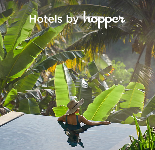 Woman enjoying hotel pool.