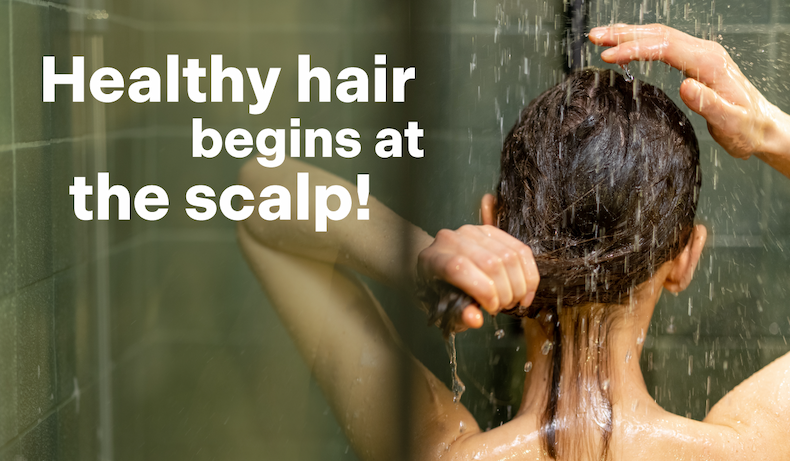 an image of a woman is washing her hair in the shower