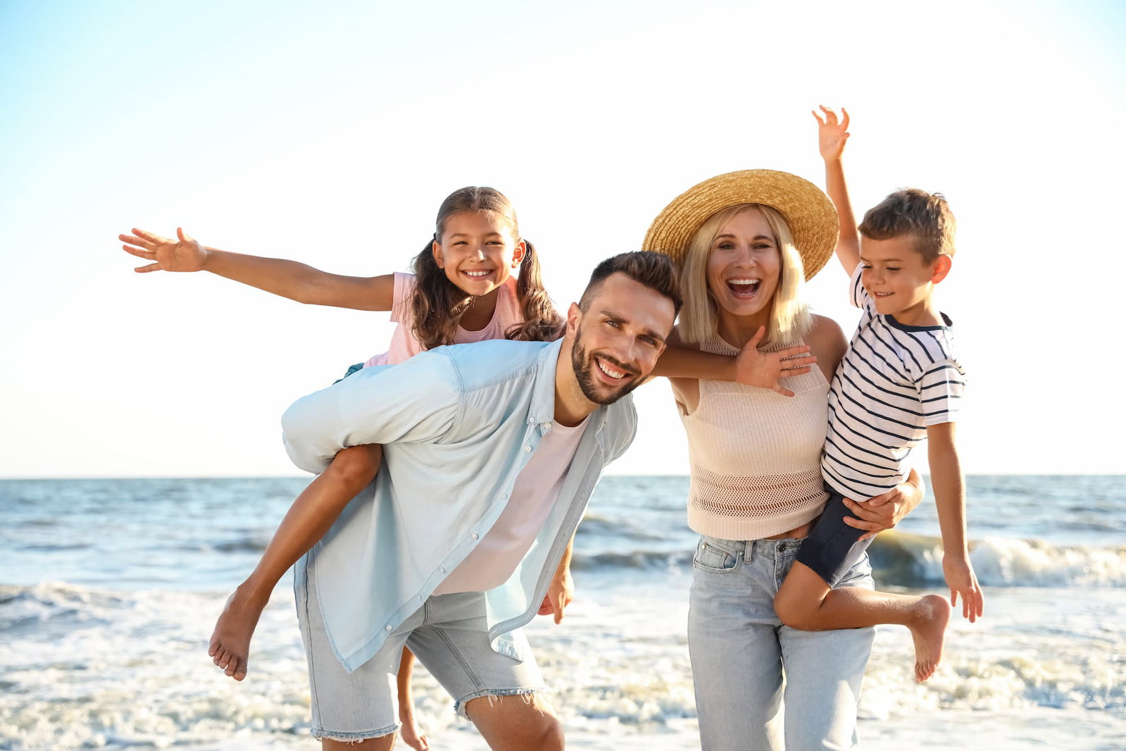 Family Playing outside on the beach