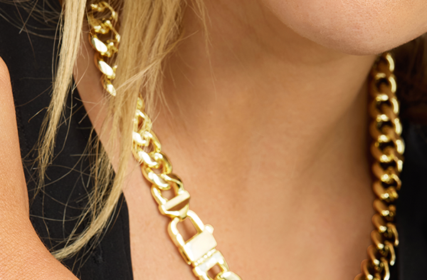 MAKE A STATEMENT: Bold gold links anchor the look—wear solo or stacked for maximum impact.