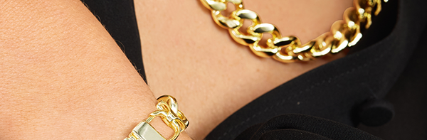 MAKE A STATEMENT: Bold gold links anchor the look—wear solo or stacked for maximum impact.