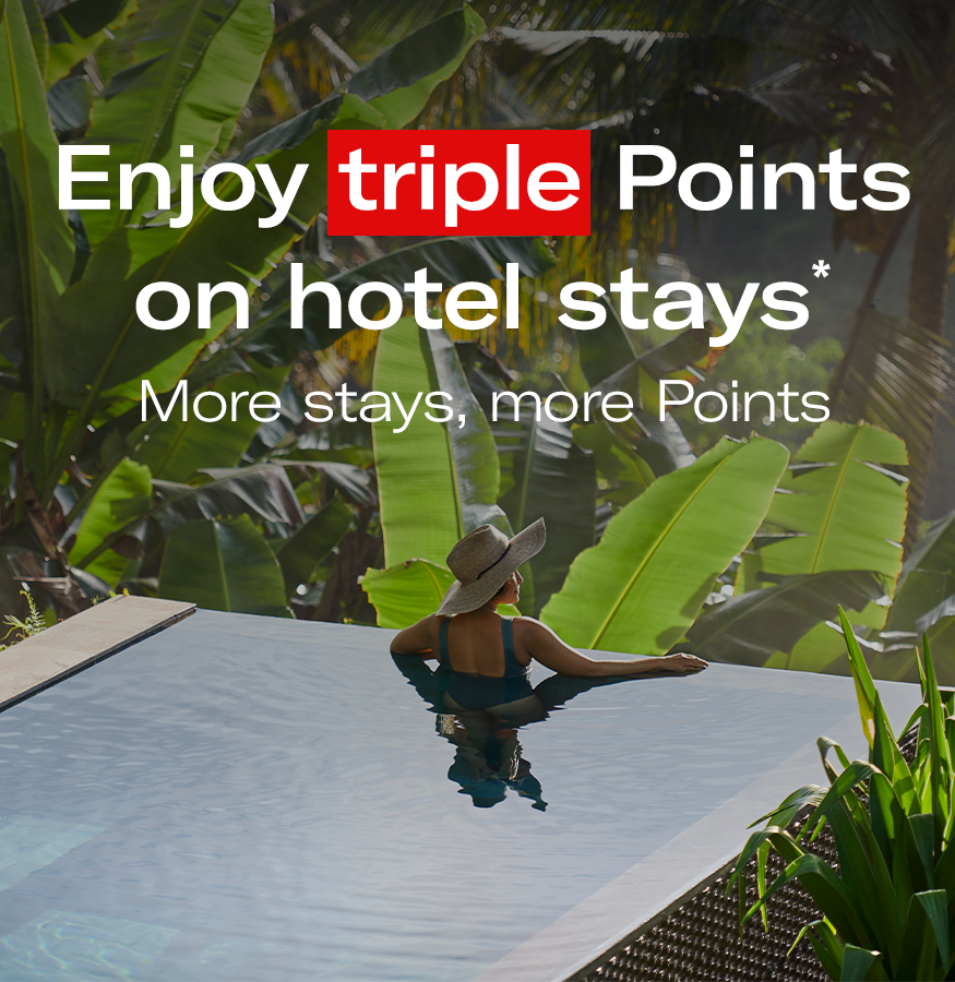 Image of a woman in a pool, with text: Enjoy triple Points on hotel stays* More Stays, more Points