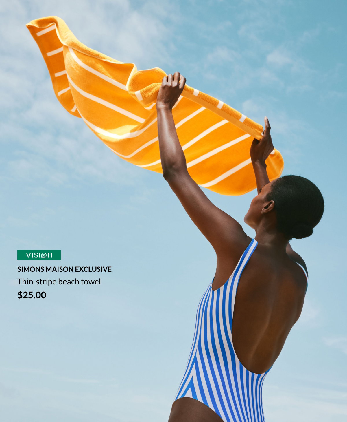 Woman in swimsuit holding a yellow and white striped bath towel $25.00