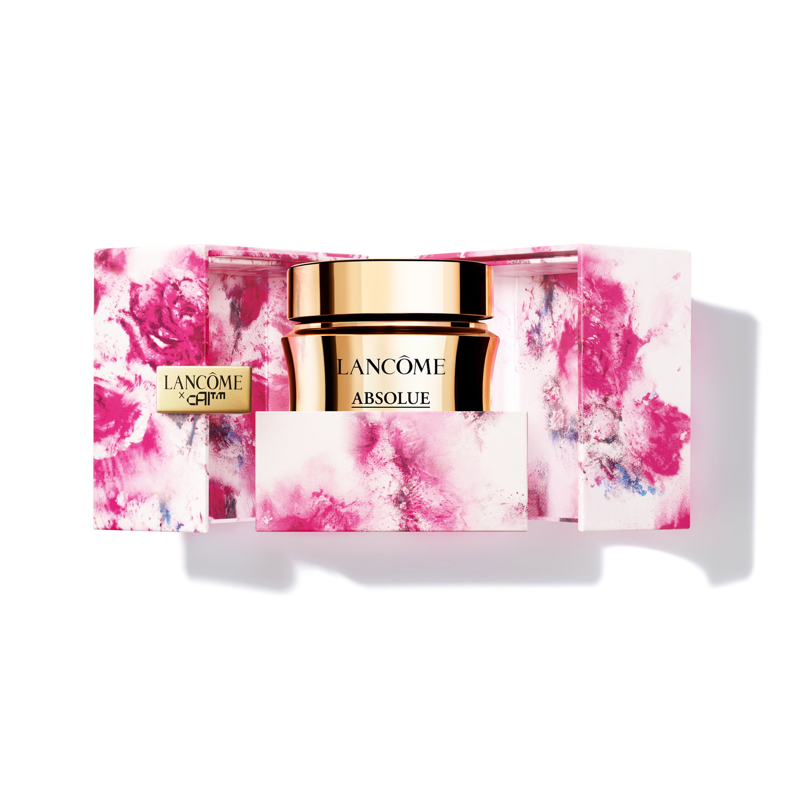 Lancôme Absolue cream in vasetto dorato nella limited edition Lancôme × CAIA con cofanetto floreale fucsia.