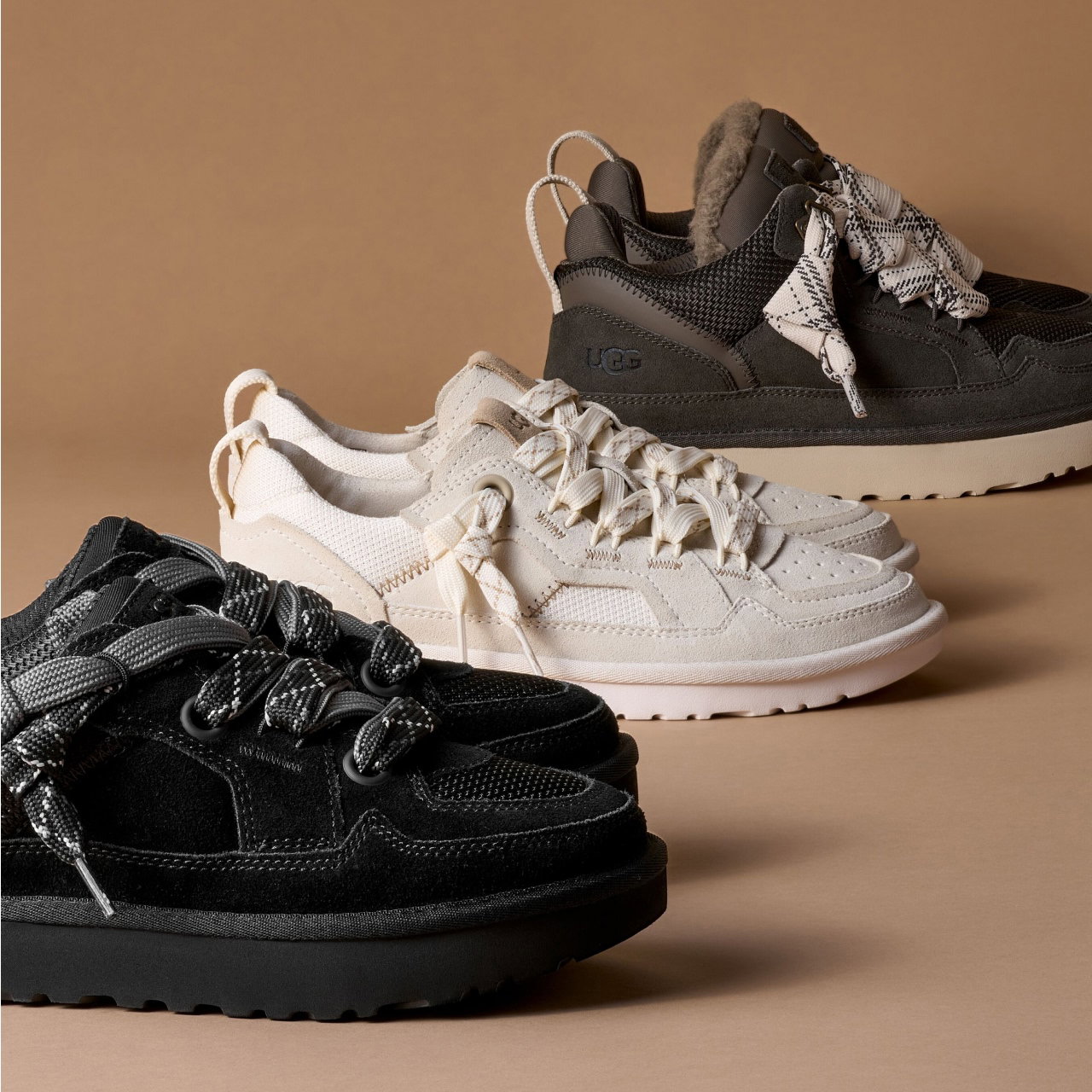 A studio shot of pairs of Lowmel, Lo Lowmel and Minimel trainers spaced apart on the ground.