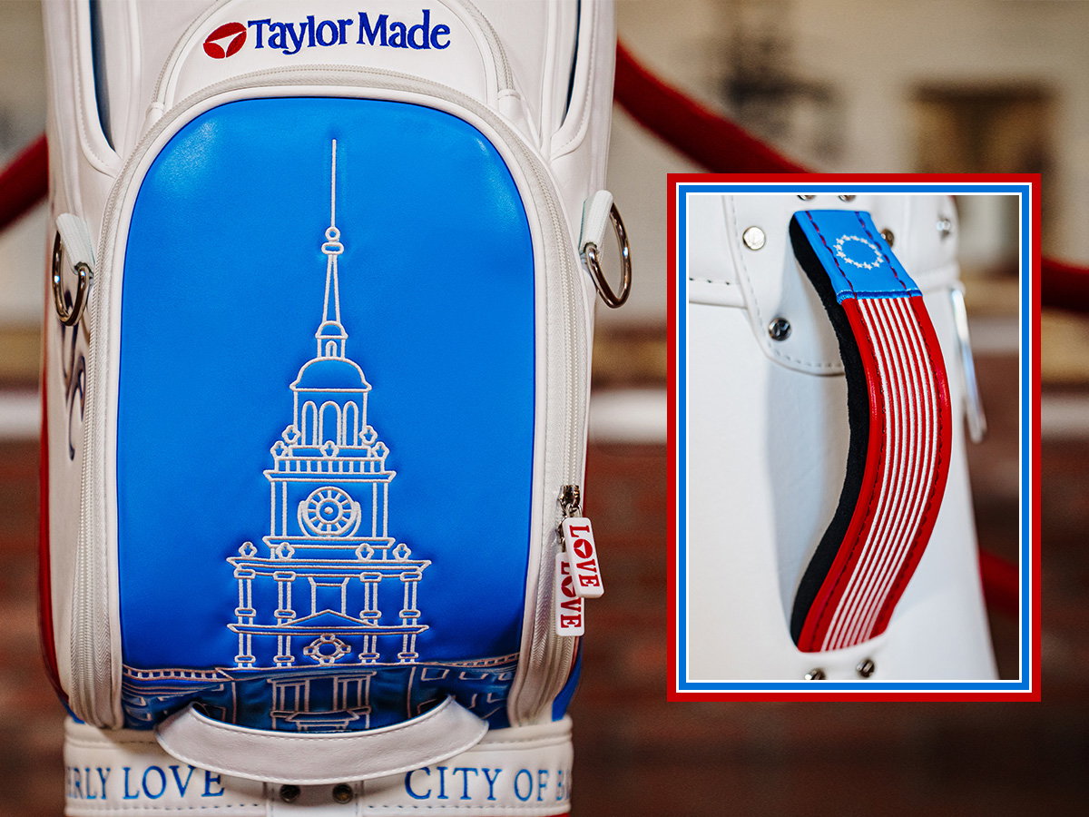 Close up of bottom of the Liberty Lines staff bag with a framed photo of the bag handle next to it