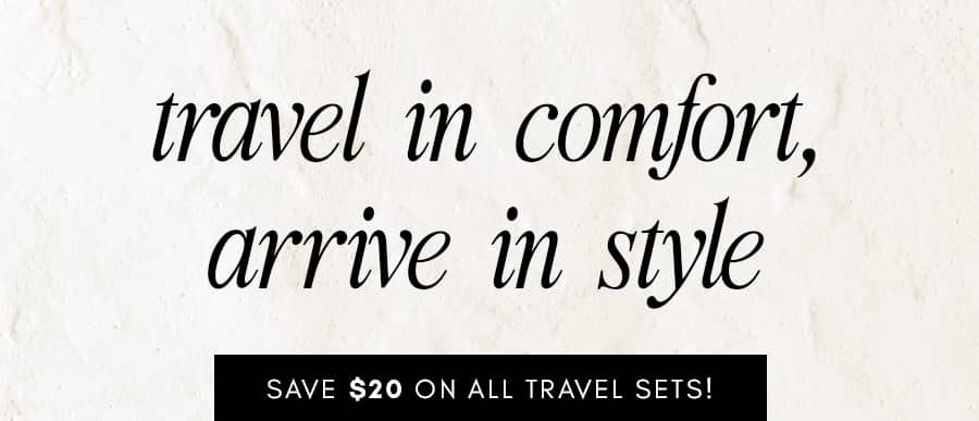A medium shot displays the text 'travel in comfort, arrive in style' in black script font against a textured off-white background, with a black bar at...