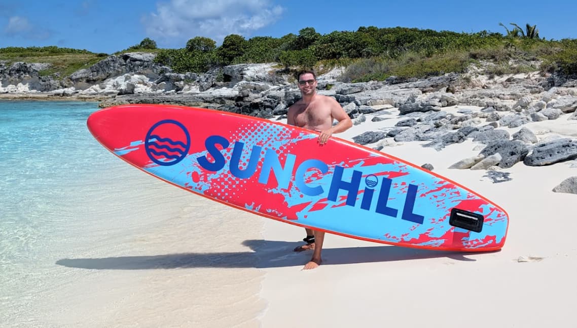 Sunchill SUP on calm water, rider standing confidently