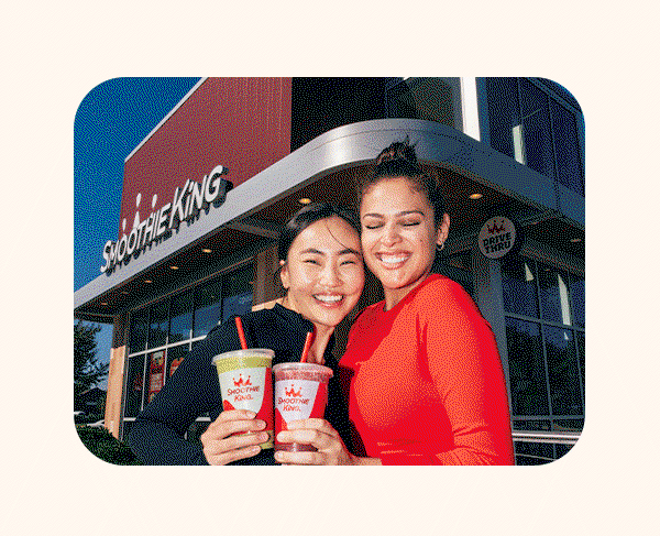Smoothie King team members enjoying drinks together