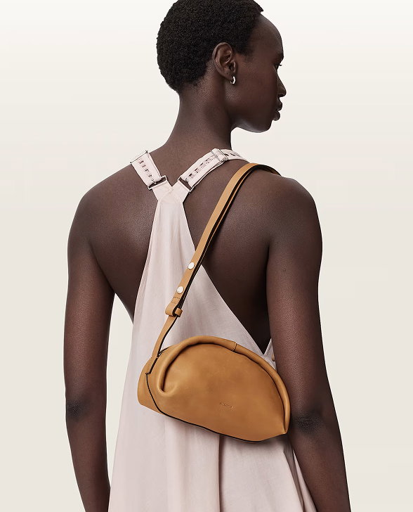 MODEL WITH BROWN HANDBAG
