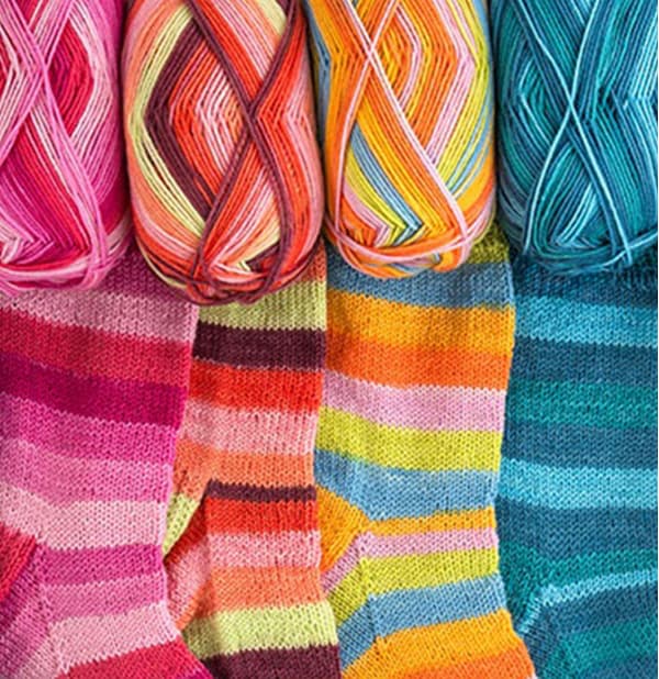 Four skeins of self-striping sock yarn >>