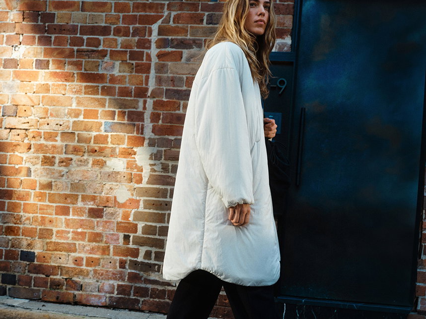 Woman wearing ThermoZen Insulated Long Jacket