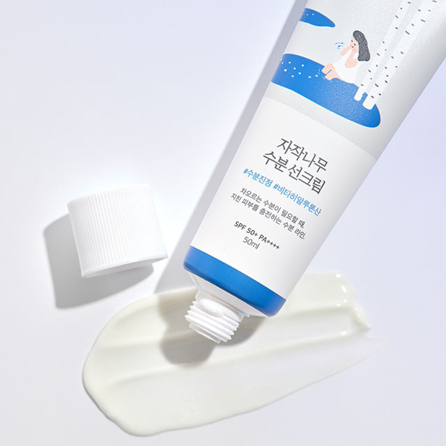 A tube of Korean skincare cream with a white and blue design, shown open with cream squeezed out.