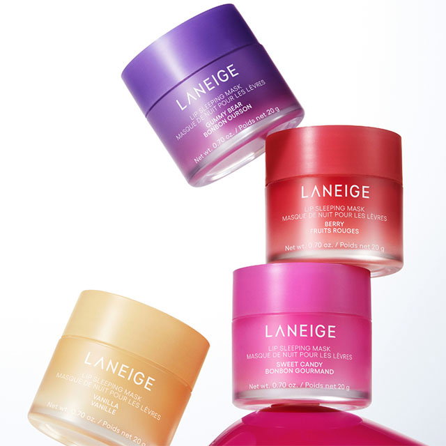 Five colorful Laneige lip sleeping mask containers arranged in an artistic display.
