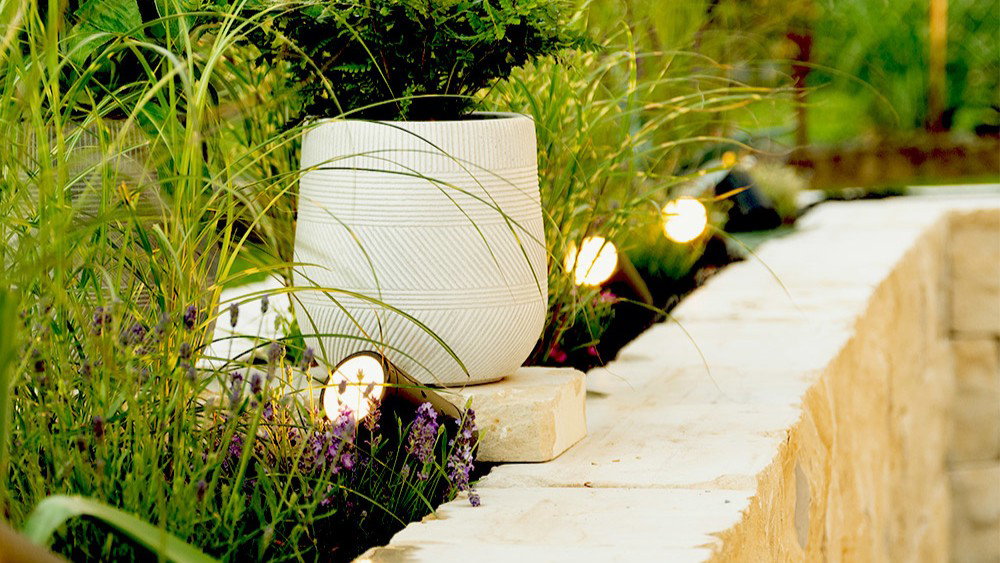 Spikey ground lights that gently illuminate a garden path