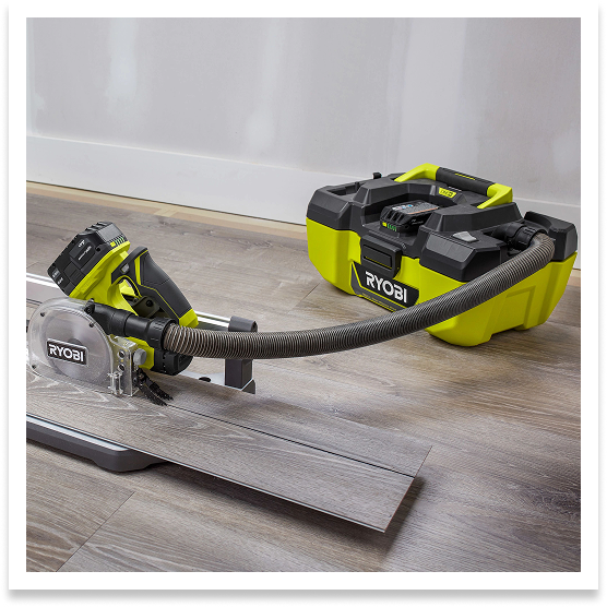 RYOBI Wet Dry Vac attached to flooring saw to capture debris. 