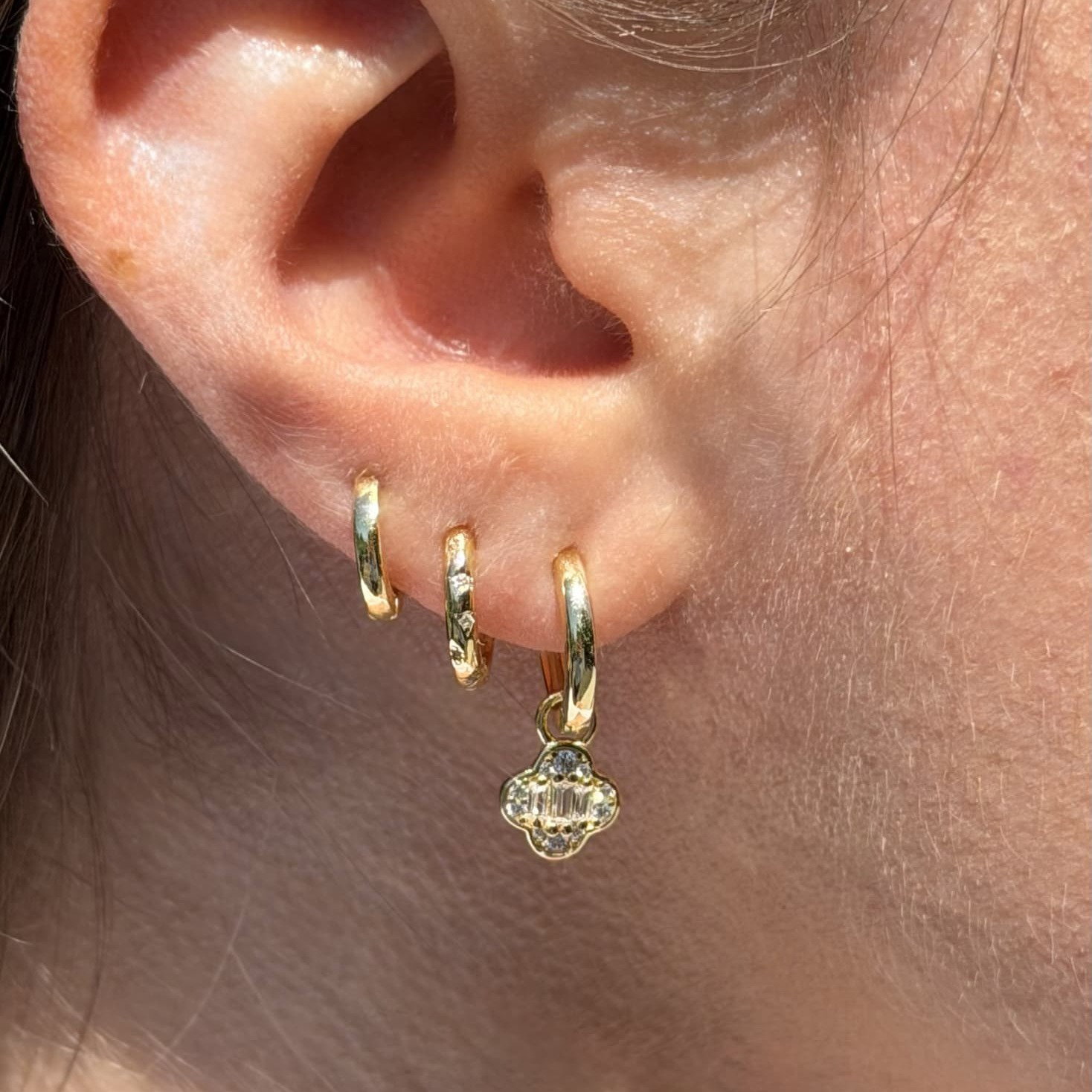A play on a four leaf clover, so she can have a good luck charm with her everywhere she goes.