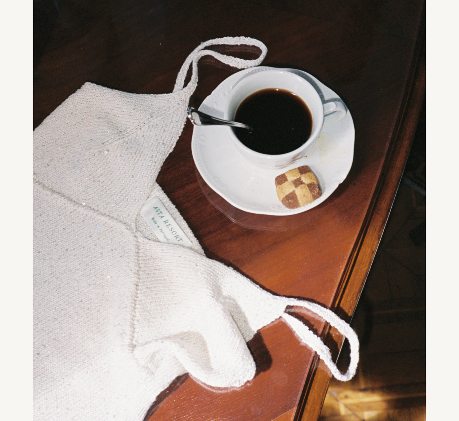 Pailette Yarn Camisole on a table with a cup of Coffee