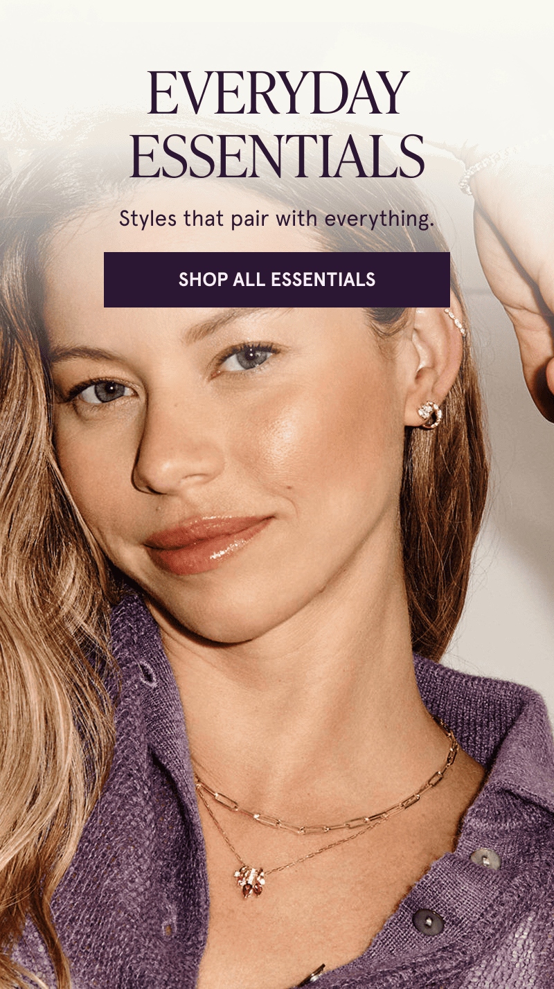 A model wearing gold gemstone necklaces. Everyday essentials that pair with everything. Click here to shop all essentials