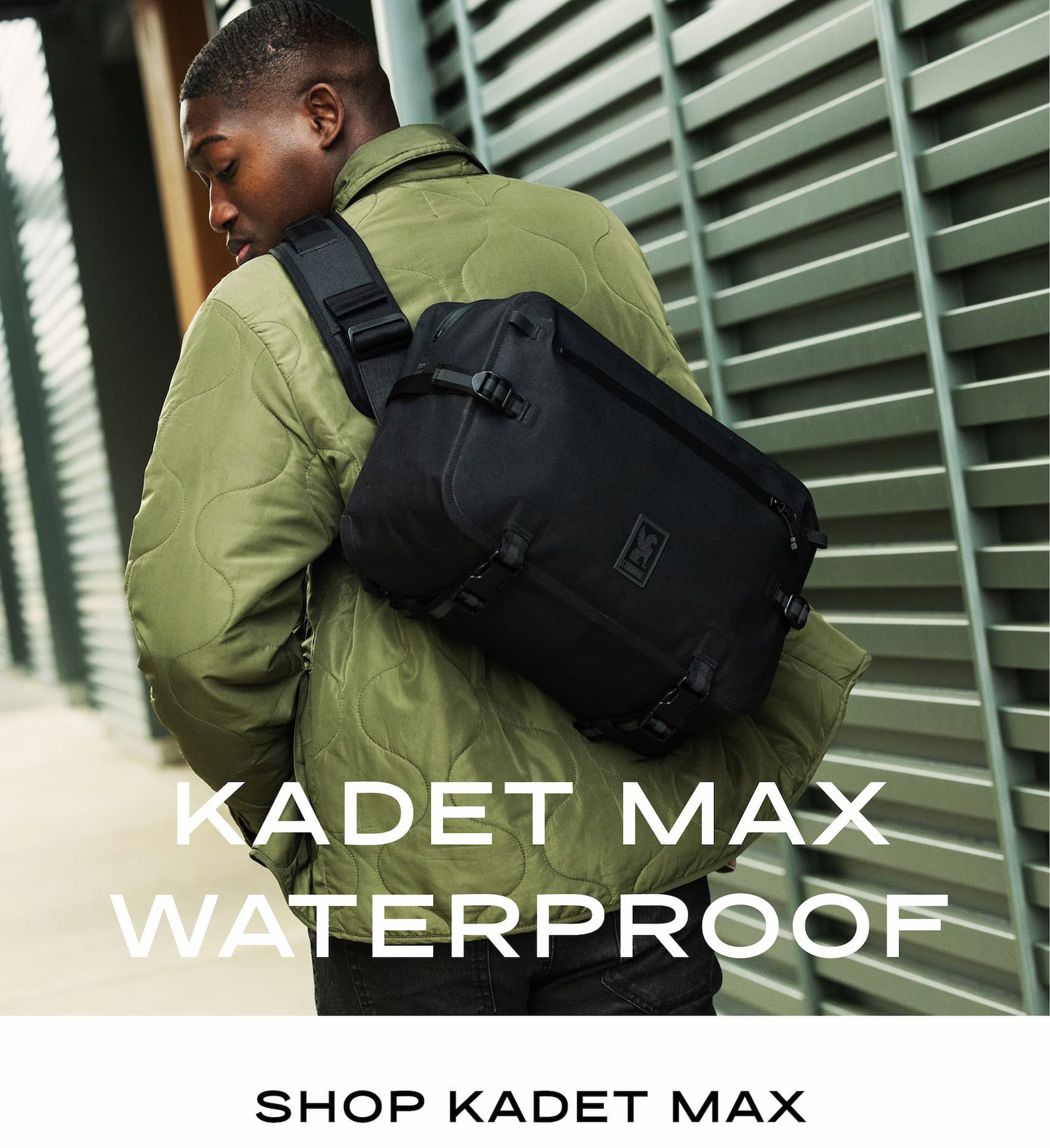 A guy walking with the Waterproof Kadet Max in black