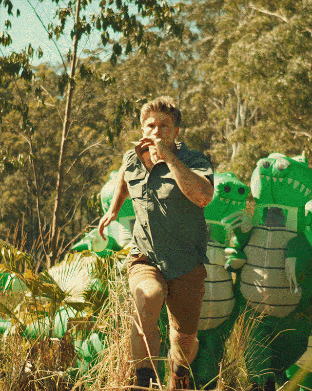 Clips of Rob Irwin running through fake crocodiles