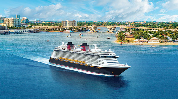 A Disney cruise ship sails away from Fort Lauderdale, FL.