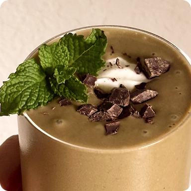 image of a mint chip glow smoothie in a glass