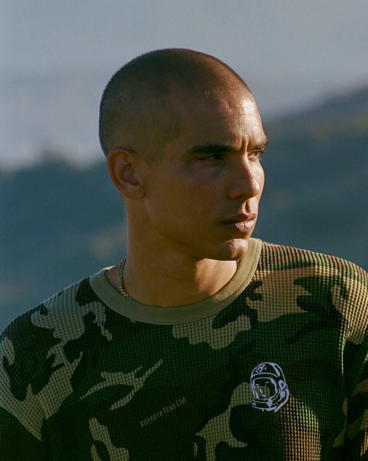 Model wearing Billionaire Boys Club camo waffle ls t-shirt