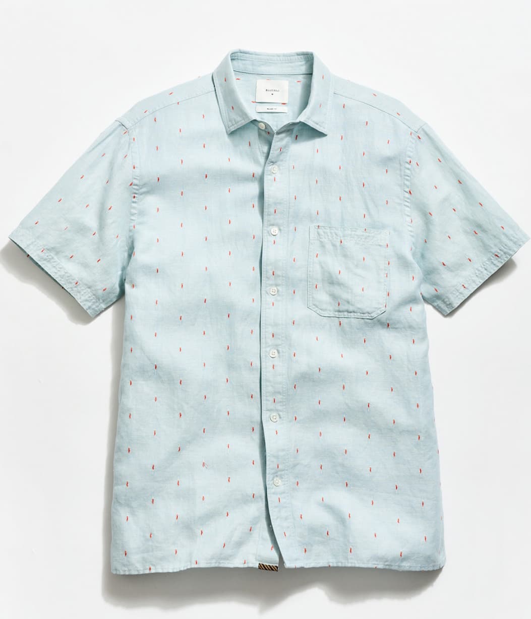 Treme shirt in sky blue on a light grey background.