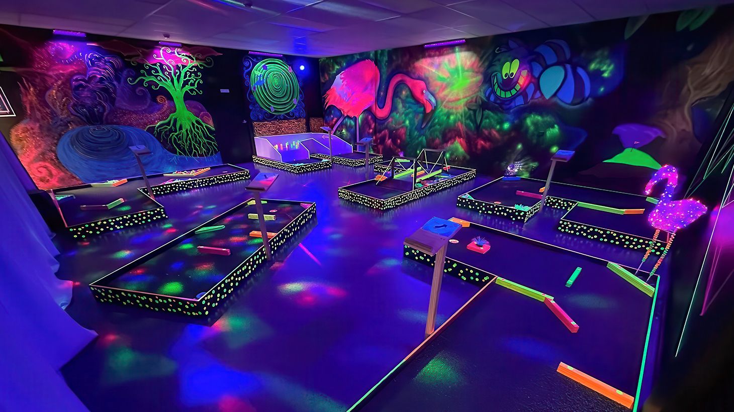 Tee-Off with an 18-Hole Mini-Golf Game in Alice in Wonderland Themed Indoor Golf Space