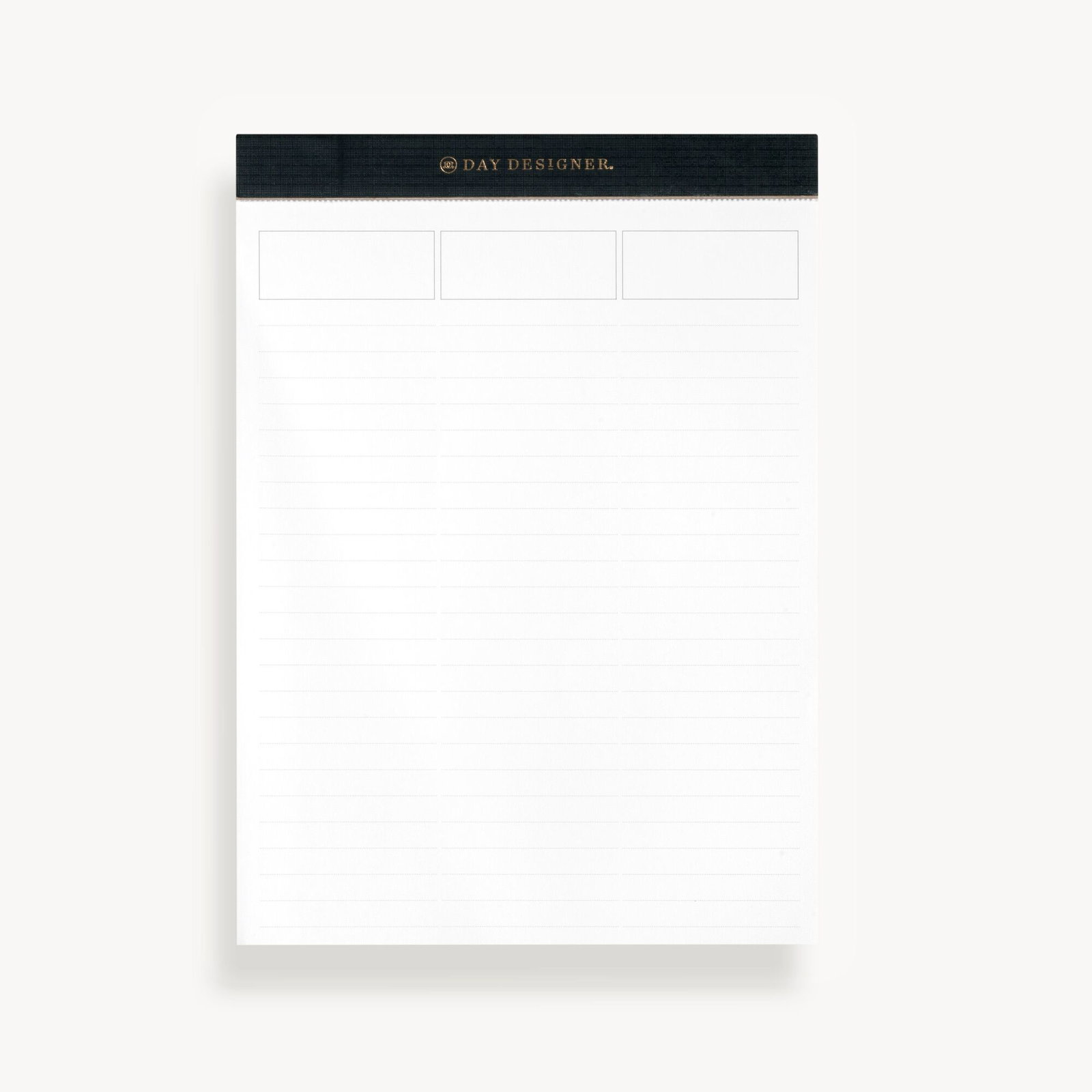 white lined notepad with black trim tape