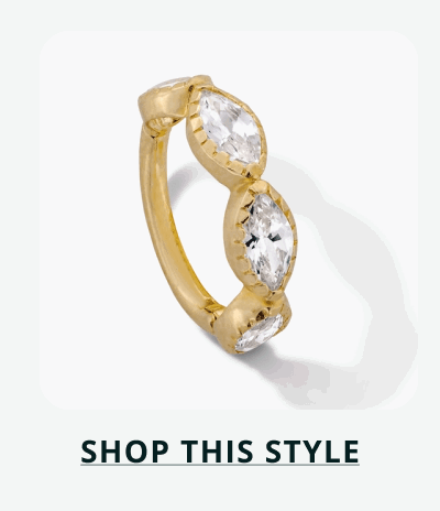 Gold rook ring, lined with three marquise stones. Click here to shop this style