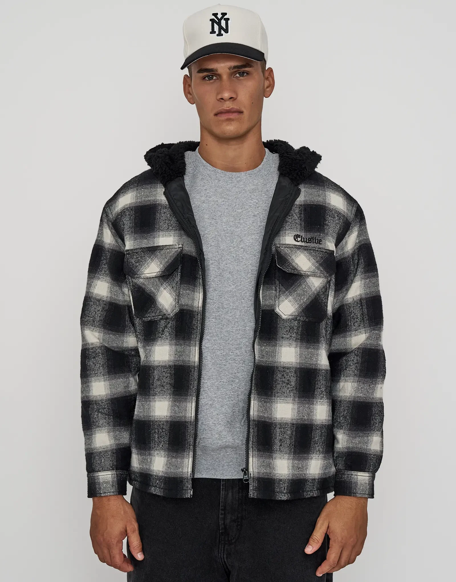 Elusive Check Sherpa Zip Up Jacket in Black Check.