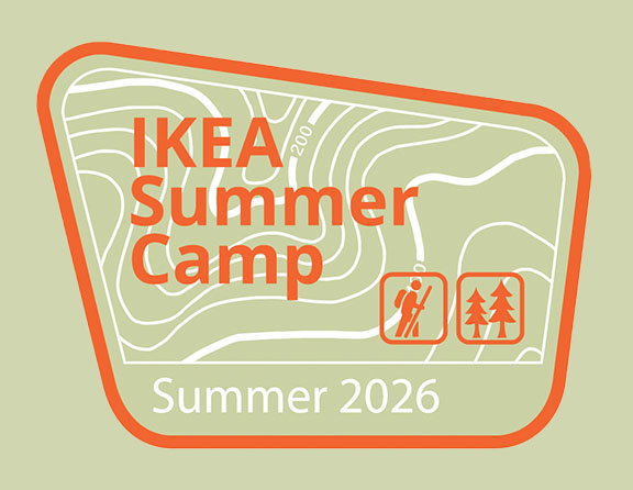 IKEA summer camp log with hiker and trees