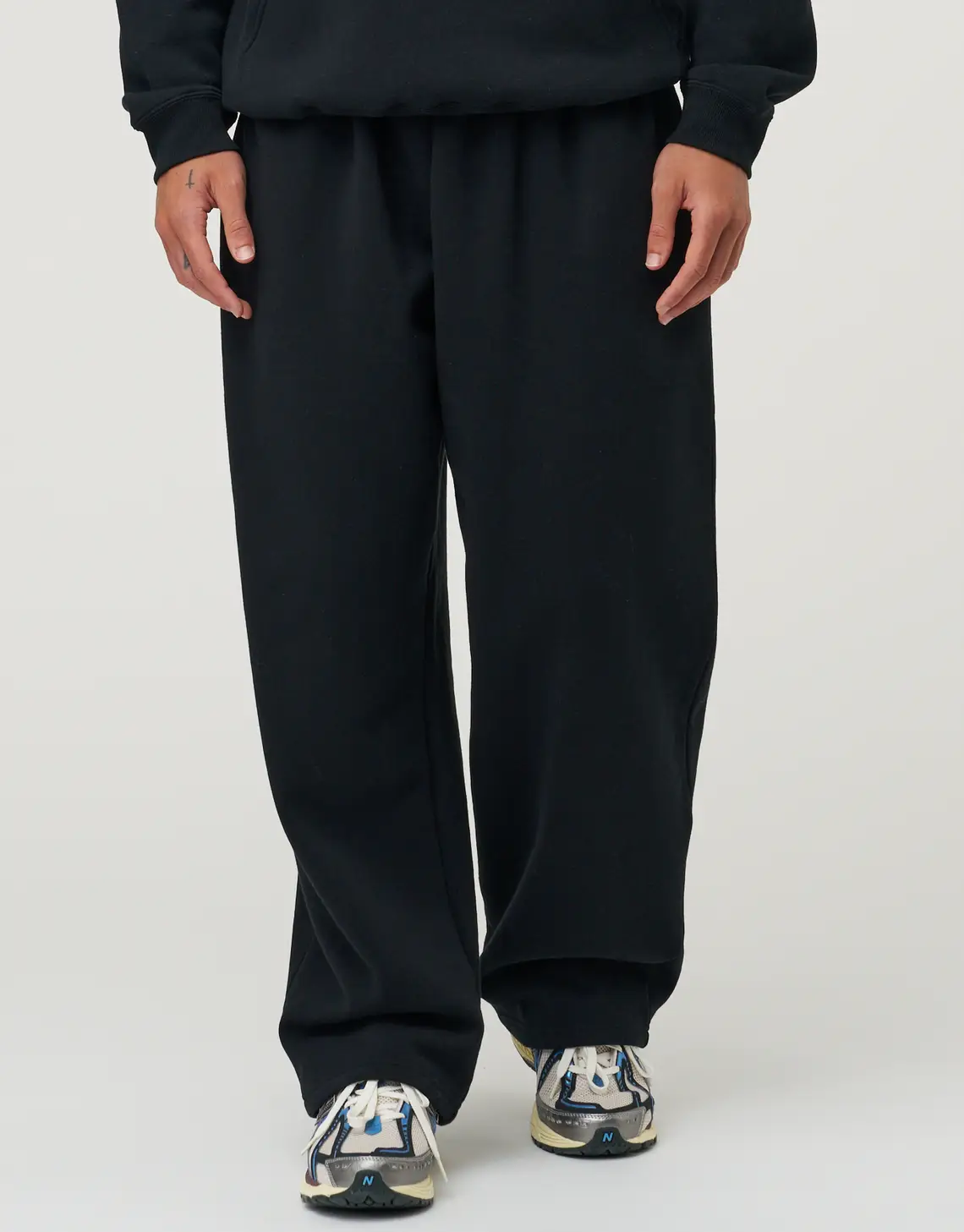 Essential Wide Track Pants in Black.