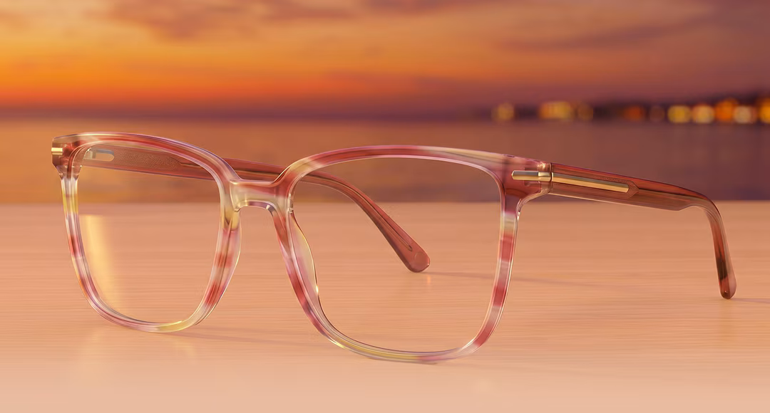 Patterned Sunset Romance frames on a surface with a sunset and distant lights in the background