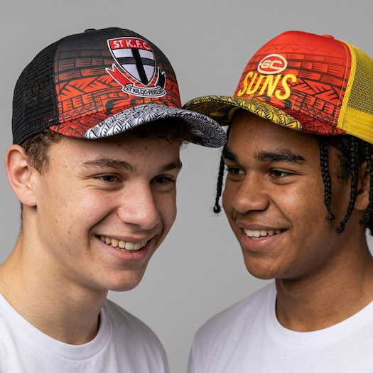 Two boys wearing AFL Indigenous Trucker Caps