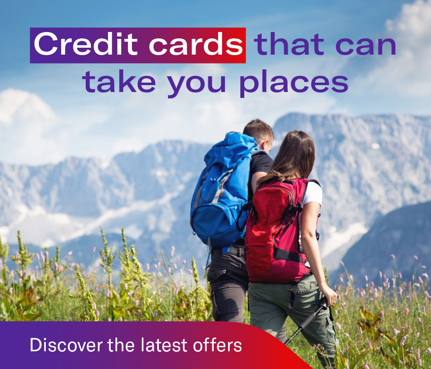 Two people hiking with mountains in the background. Headline: Credit cards that can take you places