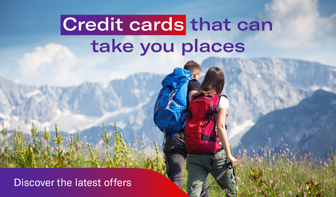 Two people hiking with mountains in the background. Headline: Credit cards that can take you places