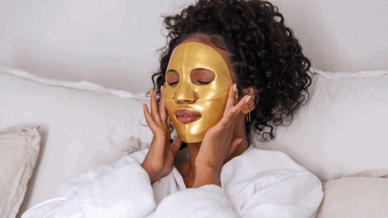 Woman wearing Gold Repair Face Mask