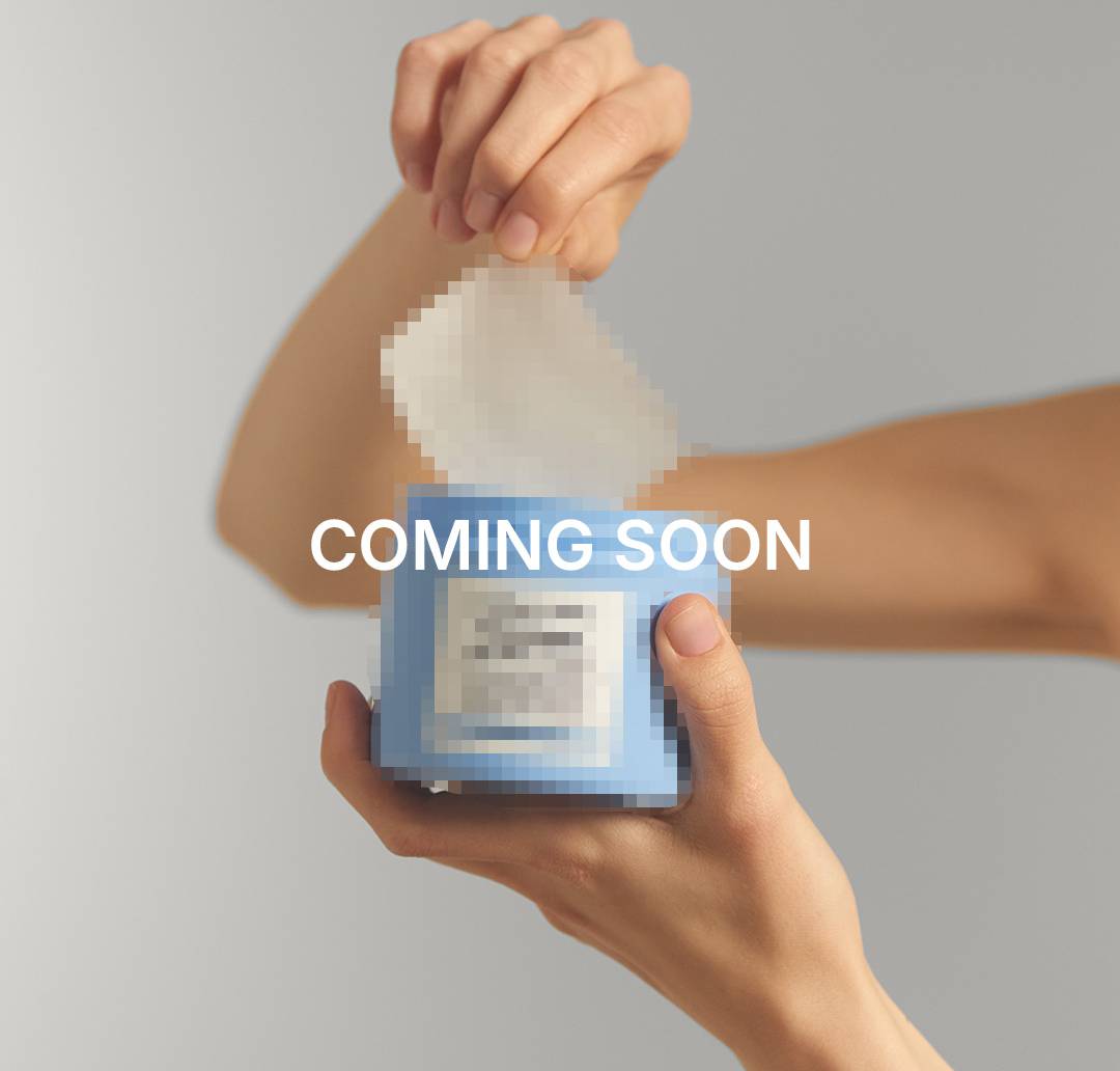 Coming soon: Hands holding a blurred out product.