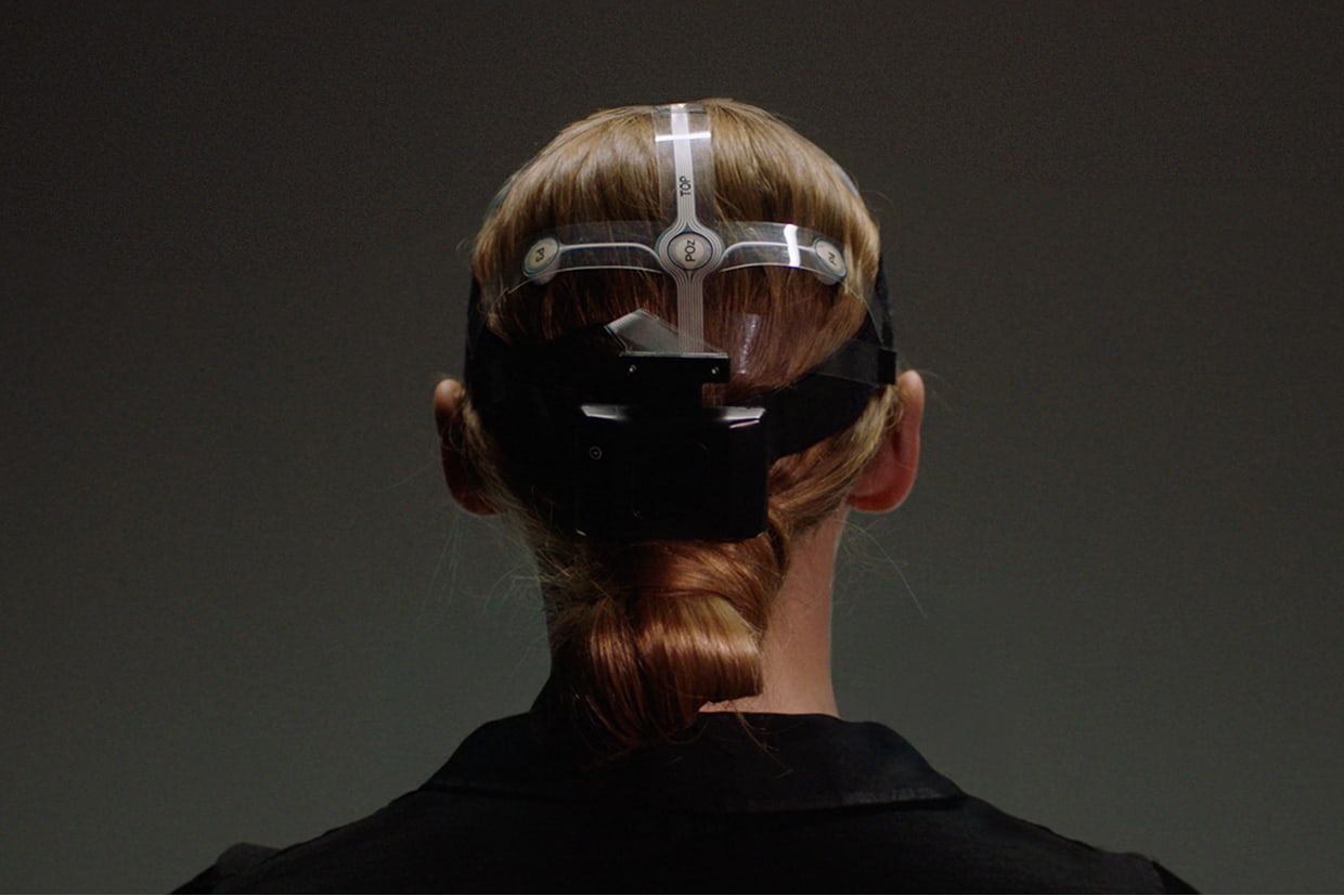 Woman wearing scientific measuring device.