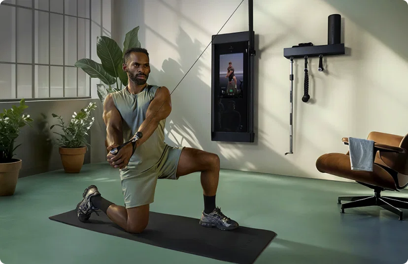 Man working out with Tonal 2 Smart Home Gym in industrial loft