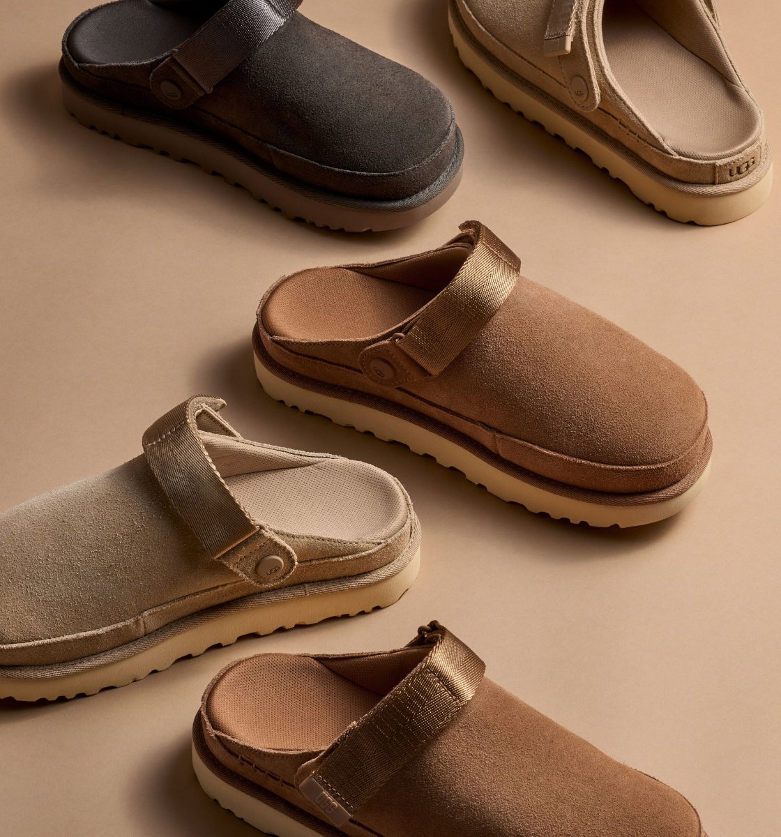 A studio shot of a selection of Goldenstar Clogs sitting on the ground.
